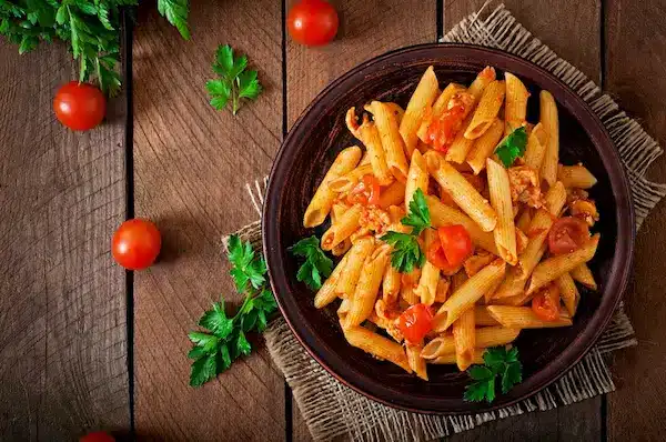 penne pasta tomato sauce with chicken tomatoes wooden table 2829 19744